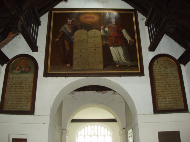 Photo of a painting of Moses and Aaron with the Ten Commandments and at a lower level the 	Lords Prayer and the Creed.