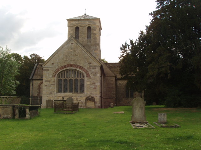 Photo of east elvation of church showing part of the graveyard.